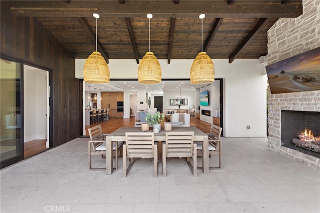 213 Avenida Princesa, San Clemente, CA 92672 - dining space with wooden ceiling with exposed beams, a fireplace, and high vaulted ceiling