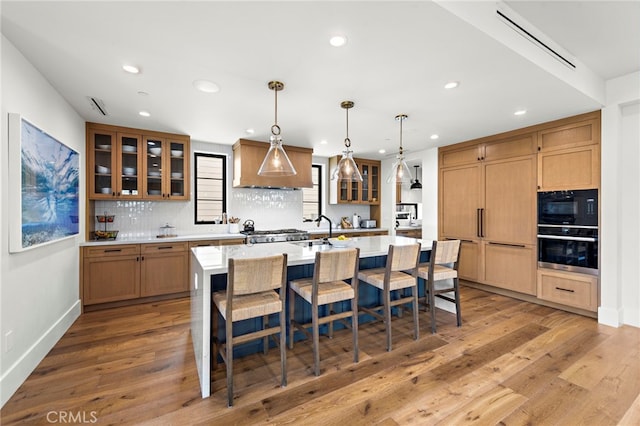 213 Avenida Princesa, San Clemente, CA 92672 - kitchen featuring stainless steel oven, recessed lighting, light countertops, decorative backsplash, and light wood finished floors