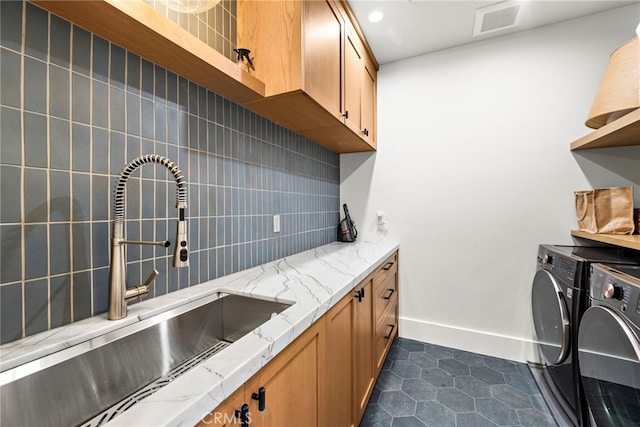 213 Avenida Princesa, San Clemente, CA 92672 - washroom with separate washer and dryer, cabinet space, dark tile patterned flooring, baseboards, and recessed lighting