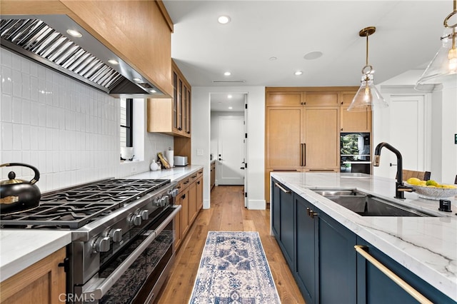 213 Avenida Princesa, San Clemente, CA 92672 - kitchen featuring range with two ovens, custom exhaust hood, a sink, backsplash, and light wood finished floors