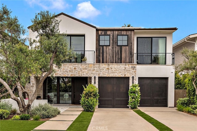 213 Avenida Princesa, San Clemente, CA 92672 - view of front of home with a balcony, concrete driveway, stone siding, and a garage