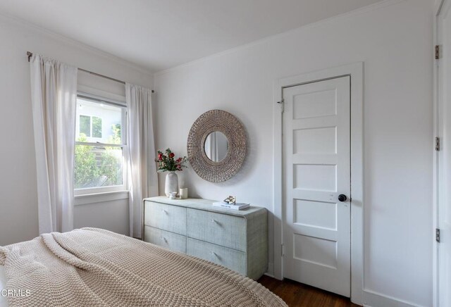 4865 Granada St, Los Angeles, CA 90042 - bedroom with ornamental molding and dark wood finished floors