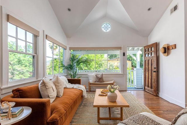 4865 Granada St, Los Angeles, CA 90042 - living area featuring wood finished floors, lofted ceiling, and baseboards