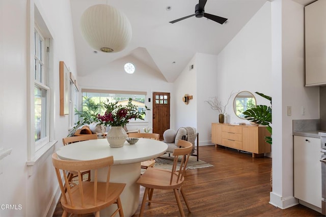 4865 Granada St, Los Angeles, CA 90042 - dining space featuring dark wood-style flooring, ceiling fan, high vaulted ceiling, and baseboards