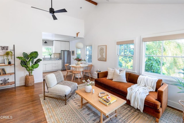 4865 Granada St, Los Angeles, CA 90042 - living room with ceiling fan, wood finished floors, high vaulted ceiling, baseboards, and beamed ceiling
