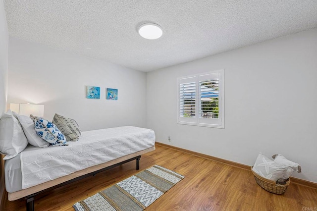 3925 Linmar Ln, Carlsbad, CA 92008 - bedroom featuring wood finished floors and a textured ceiling