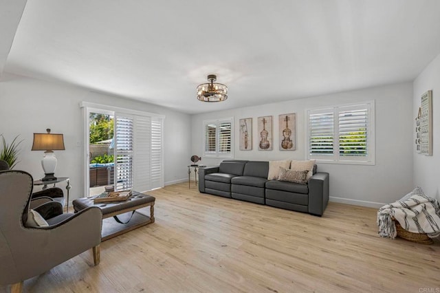 3925 Linmar Ln, Carlsbad, CA 92008 - living room featuring a chandelier and light wood-type flooring