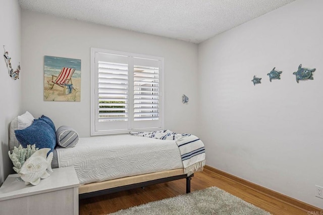 3925 Linmar Ln, Carlsbad, CA 92008 - bedroom with wood finished floors and a textured ceiling