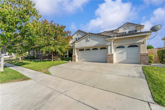 15601 N Peak Ln, Fontana, CA 92336 - view of front of house with brick siding, concrete driveway, and an attached garage