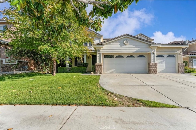 15601 N Peak Ln, Fontana, CA 92336 - view of front of house featuring brick siding, an attached garage, driveway, and a front yard