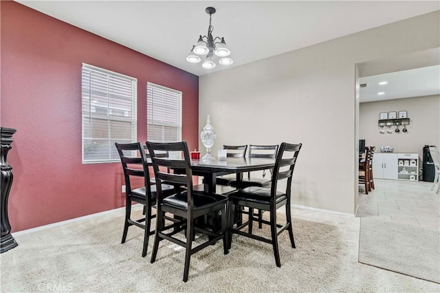 15601 N Peak Ln, Fontana, CA 92336 - carpeted dining area featuring a chandelier and baseboards
