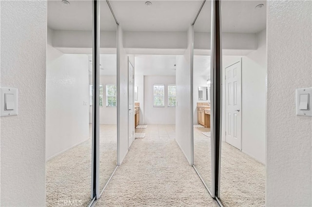 15601 N Peak Ln, Fontana, CA 92336 - corridor with carpet flooring and a textured wall