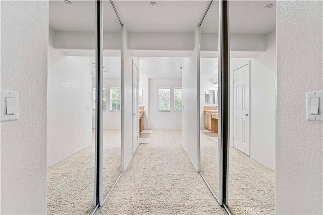 15601 N Peak Ln, Fontana, CA 92336 - hallway featuring carpet flooring and a textured wall
