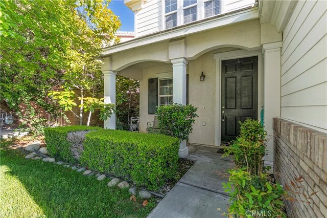 15601 N Peak Ln, Fontana, CA 92336 - property entrance with a porch