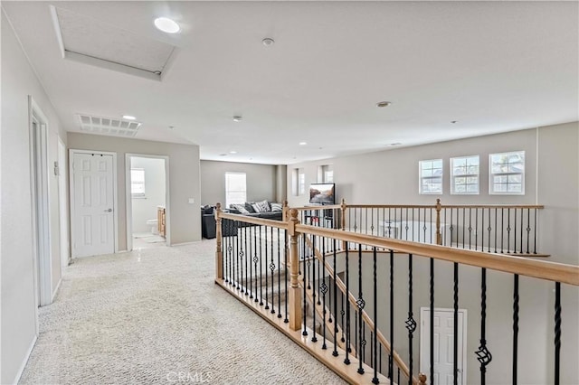 15601 N Peak Ln, Fontana, CA 92336 - hallway with healthy amount of natural light, attic access, baseboards, and recessed lighting