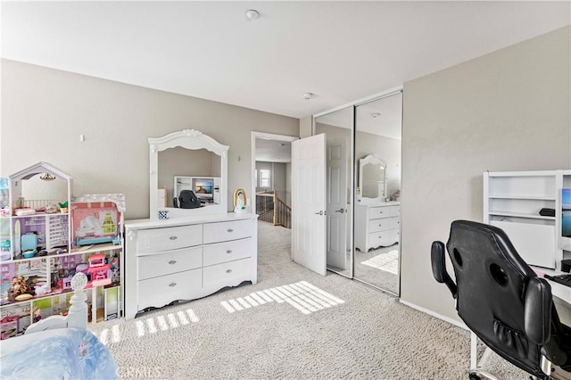 15601 N Peak Ln, Fontana, CA 92336 - bedroom featuring light colored carpet, a closet, and a desk