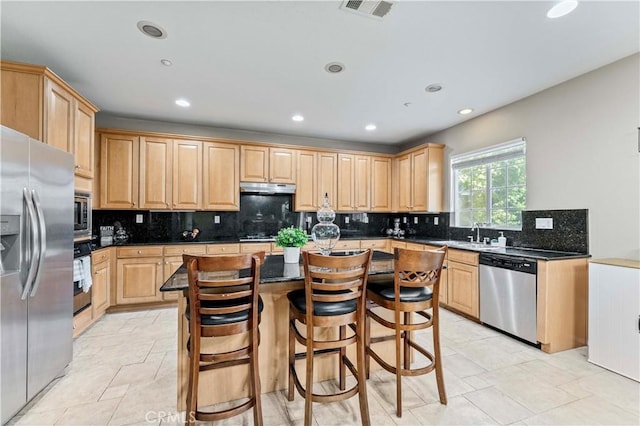 15601 N Peak Ln, Fontana, CA 92336 - kitchen with stainless steel appliances, light brown cabinetry, recessed lighting, tasteful backsplash, and a kitchen island