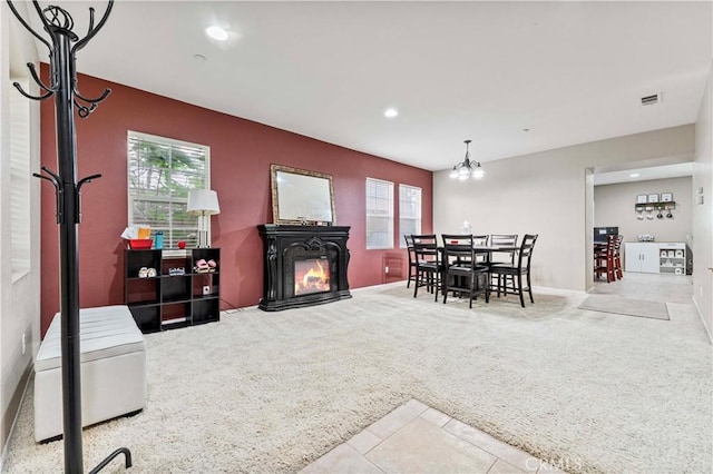 15601 N Peak Ln, Fontana, CA 92336 - tiled dining space with carpet flooring, recessed lighting, a chandelier, and a glass covered fireplace