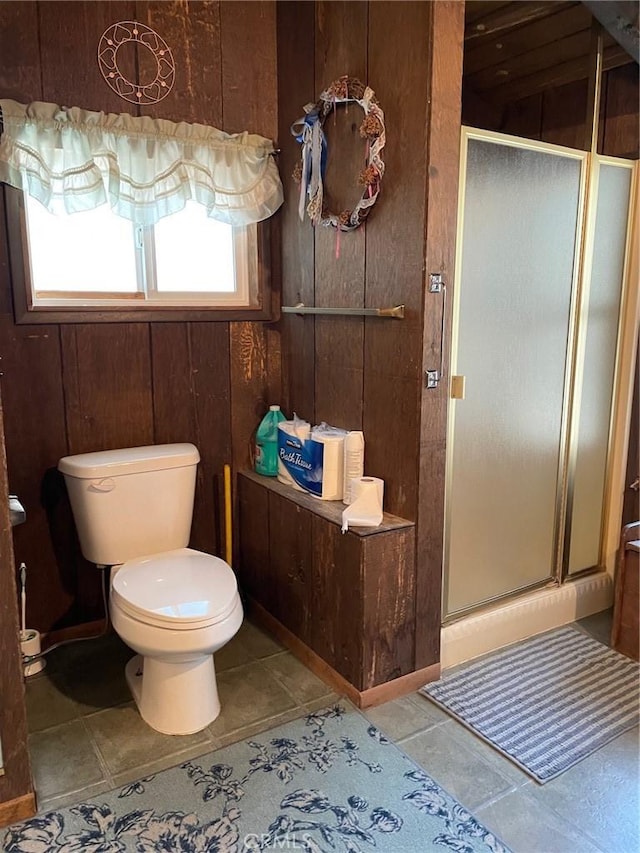 320 Starvation Flats Rd, Big Bear Lake, CA 92315 - bathroom with a shower stall, toilet, wooden walls, and tile patterned flooring