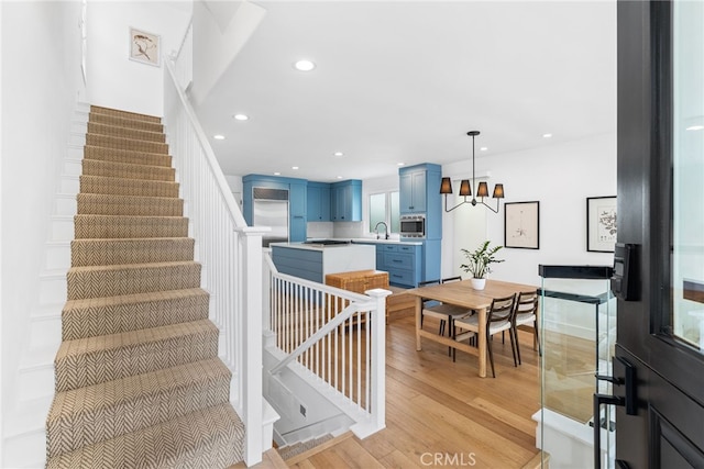 332 L St, Newport Beach, CA 92661 - stairs with wood finished floors, a chandelier, and recessed lighting