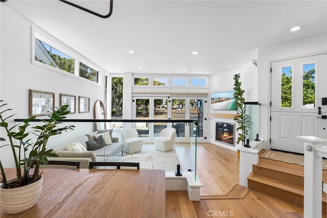 332 L St, Newport Beach, CA 92661 - living area featuring french doors, plenty of natural light, light wood-style flooring, recessed lighting, and a glass covered fireplace