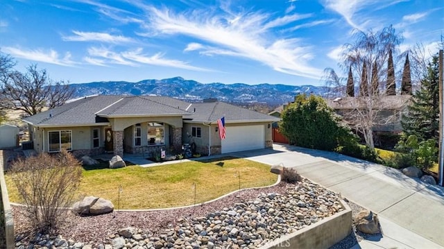 22104 Mccarthy Dr, Tehachapi, CA 93561 - ranch-style home with a mountain view, driveway, stucco siding, an attached garage, and a front yard