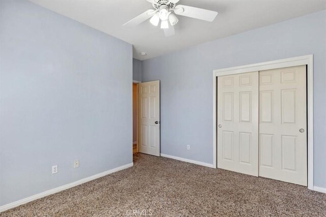 22104 Mccarthy Dr, Tehachapi, CA 93561 - unfurnished bedroom featuring carpet floors, a closet, baseboards, and ceiling fan