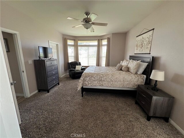 22104 Mccarthy Dr, Tehachapi, CA 93561 - bedroom featuring light colored carpet, baseboards, and a ceiling fan