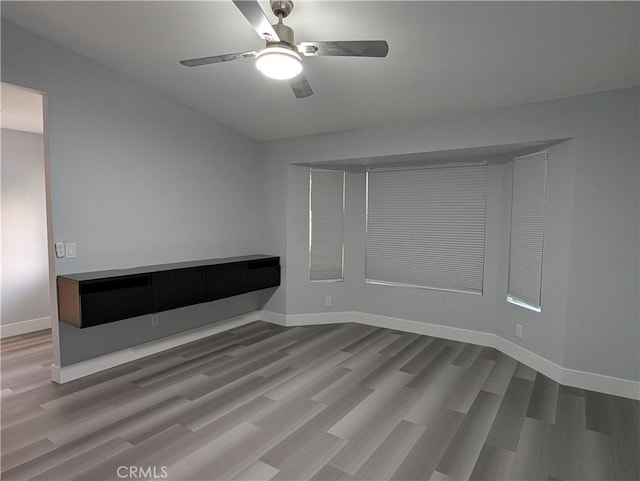 23040 Giant Fir Pl, Canyon Lake, CA 92587 - spare room featuring a ceiling fan, wood finished floors, and baseboards