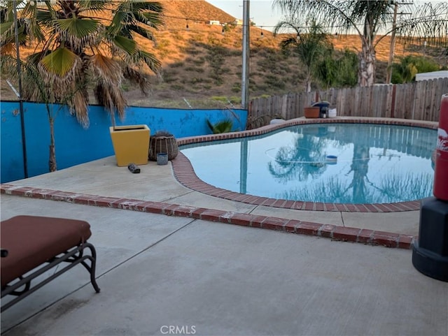 23040 Giant Fir Pl, Canyon Lake, CA 92587 - view of swimming pool featuring a patio area and a fenced backyard