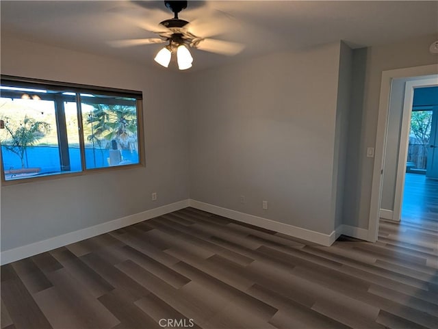 23040 Giant Fir Pl, Canyon Lake, CA 92587 - empty room with dark wood-style floors, baseboards, and a ceiling fan