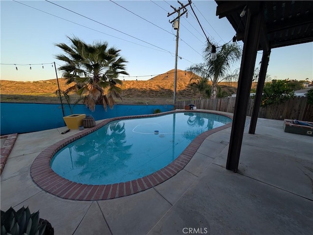 23040 Giant Fir Pl, Canyon Lake, CA 92587 - view of swimming pool featuring a patio, a fenced backyard, and a mountain view