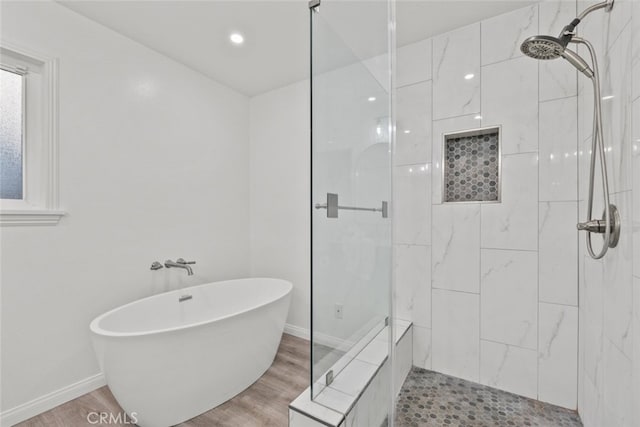 13247 Mission Tierra Way, Granada Hills, CA 91344 - full bathroom with a stall shower, a freestanding tub, baseboards, and wood finished floors