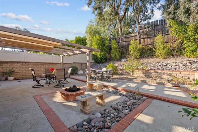 13247 Mission Tierra Way, Granada Hills, CA 91344 - fenced backyard with a fire pit, outdoor dining space, a patio area, and a pergola