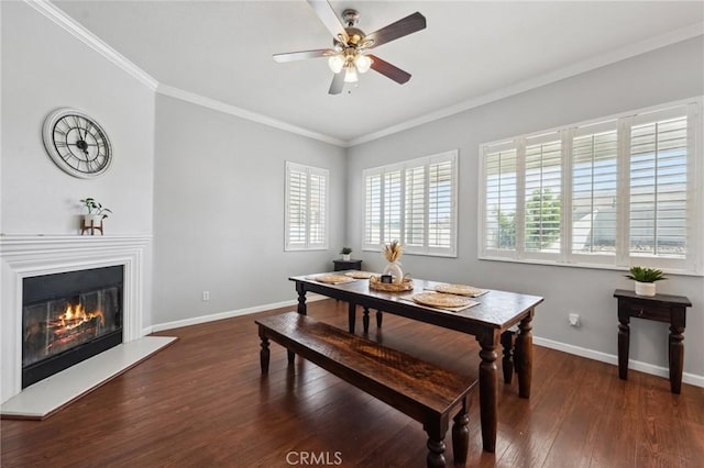 10237 Cotoneaster St, Apple Valley, CA 92308 - dining room with baseboards, crown molding, wood finished floors, a ceiling fan, and a glass covered fireplace