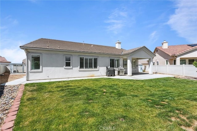 10237 Cotoneaster St, Apple Valley, CA 92308 - rear view of house with a patio area and stucco siding