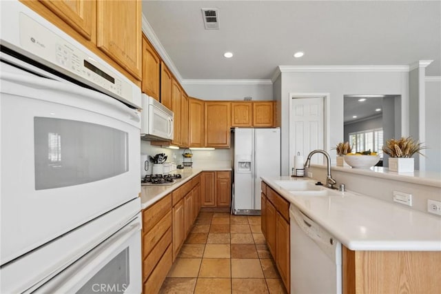 10237 Cotoneaster St, Apple Valley, CA 92308 - kitchen with white appliances, a sink, ornamental molding, light countertops, and recessed lighting