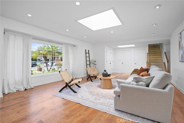 2704 Albatross Dr, Costa Mesa, CA 92626 - living area with a skylight, stairs, wood finished floors, recessed lighting, and baseboards
