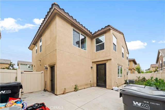 5874 Silver Oaks Dr, Chino, CA 91710 - rear view of property featuring stucco siding, a patio, and a tile roof