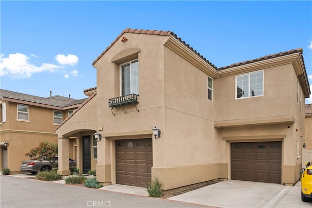 5874 Silver Oaks Dr, Chino, CA 91710 - view of front of property featuring a garage, stucco siding, and a tile roof
