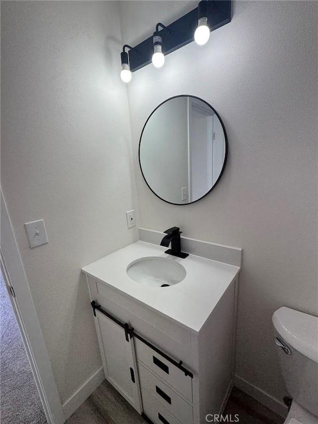 37146 Lombardy Ave, Barstow, CA 92311 - bathroom with vanity, toilet, and baseboards
