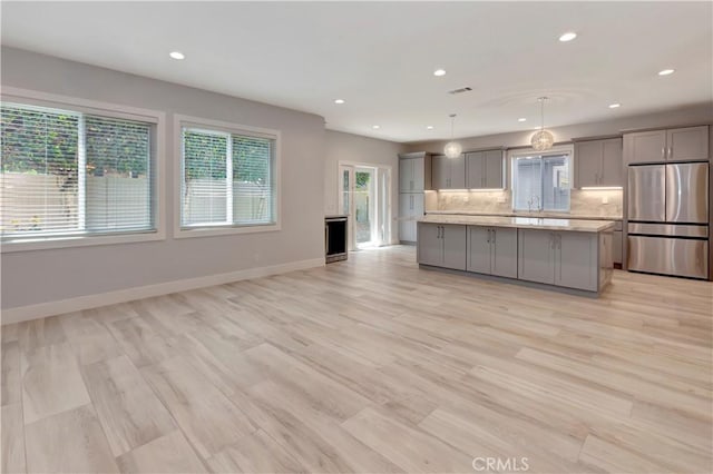 26242 Via Corrizo, San Juan Capistrano, CA 92675 - kitchen with stainless steel fridge, gray cabinets, a sink, light countertops, and recessed lighting
