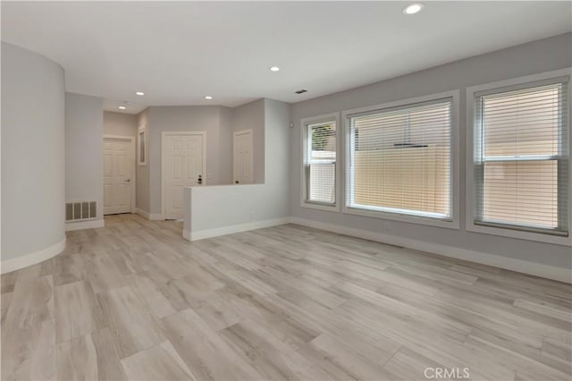 26242 Via Corrizo, San Juan Capistrano, CA 92675 - unfurnished living room with baseboards, recessed lighting, and light wood-type flooring