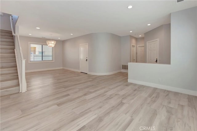 26242 Via Corrizo, San Juan Capistrano, CA 92675 - unfurnished living room featuring stairway, a chandelier, recessed lighting, light wood finished floors, and baseboards