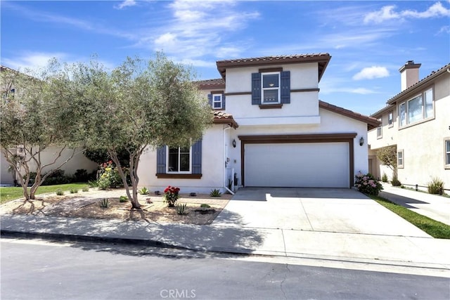 26242 Via Corrizo, San Juan Capistrano, CA 92675 - mediterranean / spanish home with a tiled roof, concrete driveway, stucco siding, and an attached garage