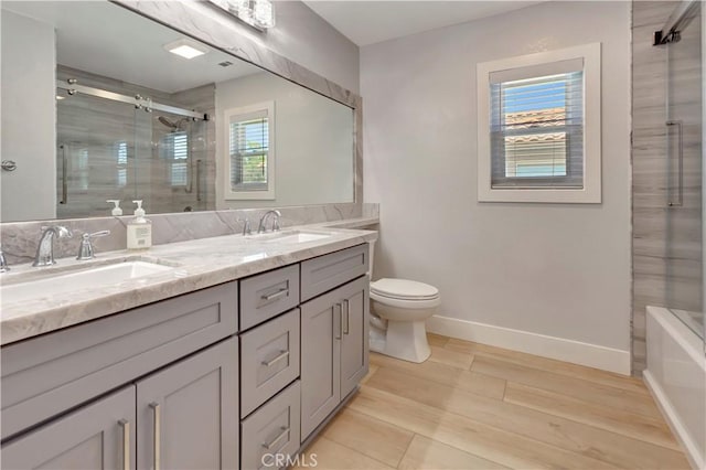26242 Via Corrizo, San Juan Capistrano, CA 92675 - bathroom featuring a shower with shower door, double vanity, and healthy amount of natural light
