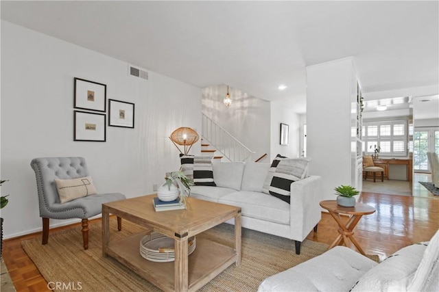 3441 Lilly Ave, Long Beach, CA 90808 - living room featuring stairs, baseboards, and a chandelier