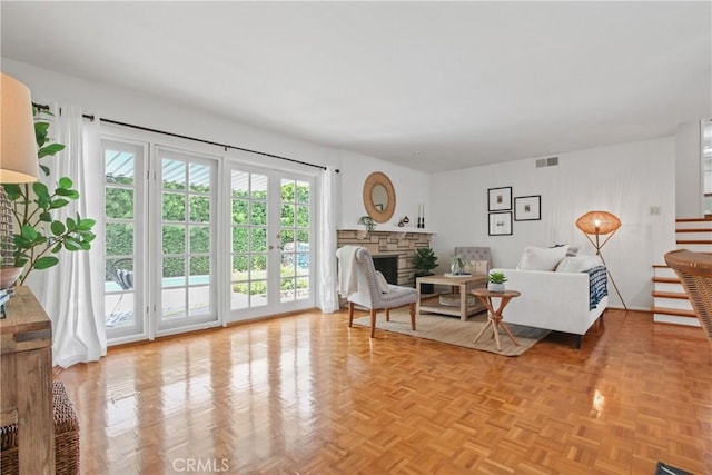 3441 Lilly Ave, Long Beach, CA 90808 - living room featuring stairway and a fireplace