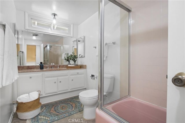 3441 Lilly Ave, Long Beach, CA 90808 - bathroom featuring toilet, vanity, and shower / bath combination with glass door