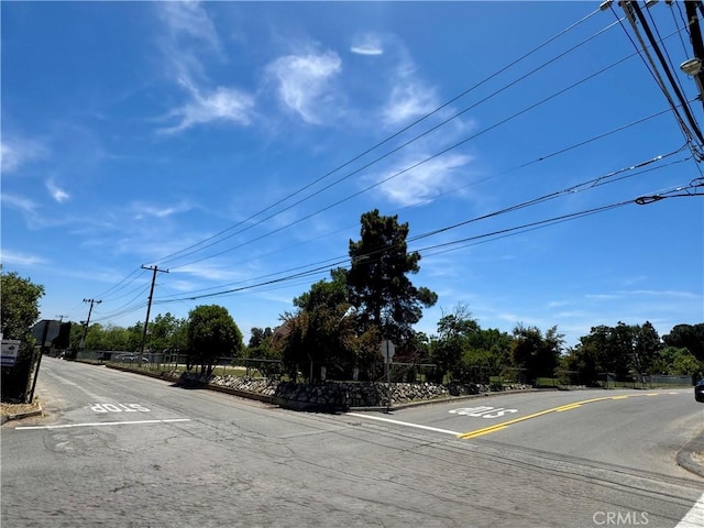 10265 Nancy Ave, Cherry Valley, CA 92223 - view of asphalt street featuring traffic signs